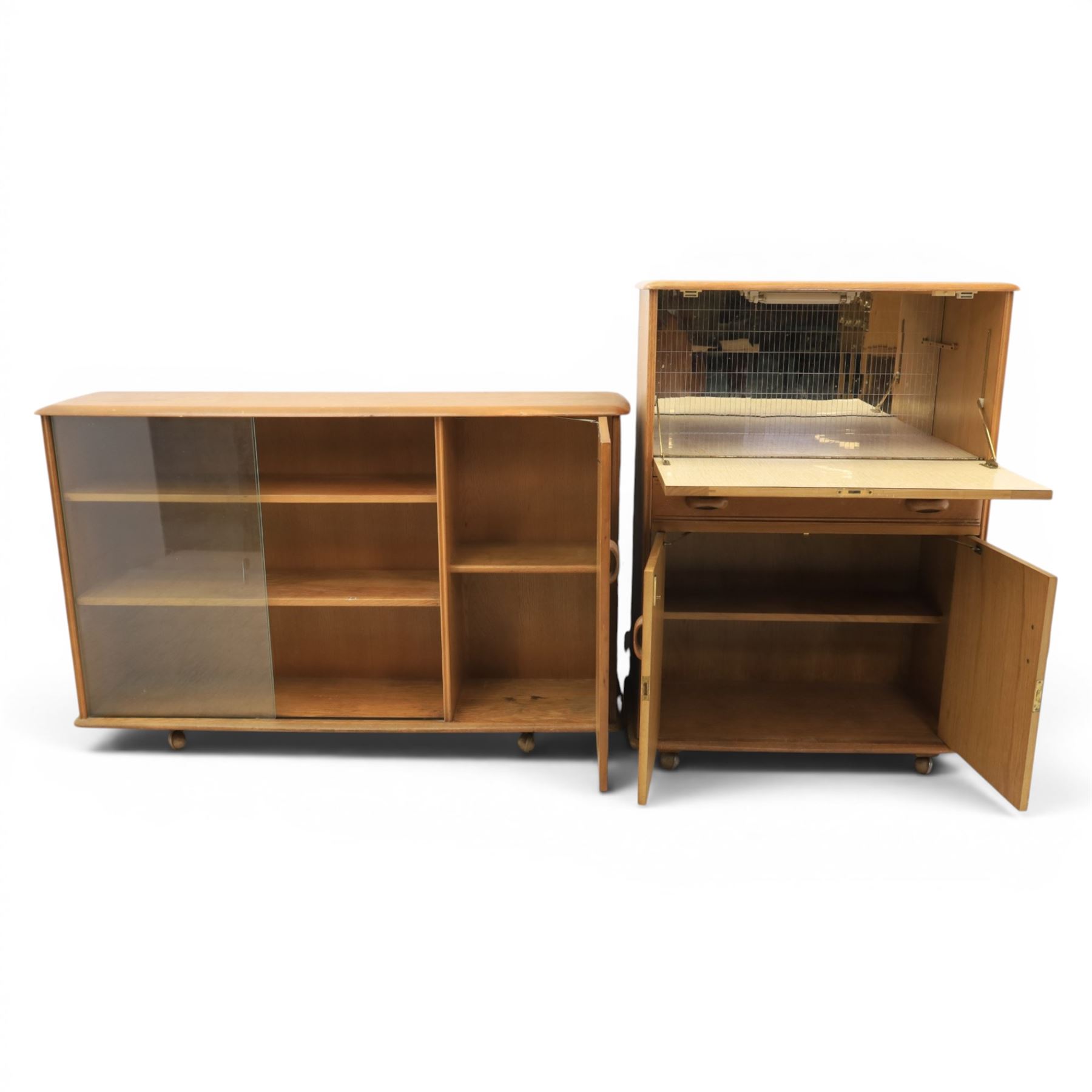 Mid-20th century elm and beech drinks cabinet with fall-front, with matching low bookcase

(Cabinet H 113cm, D 42cm, W 80cm)
(Bookcase H 87cm, D 35cm, W 137cm)