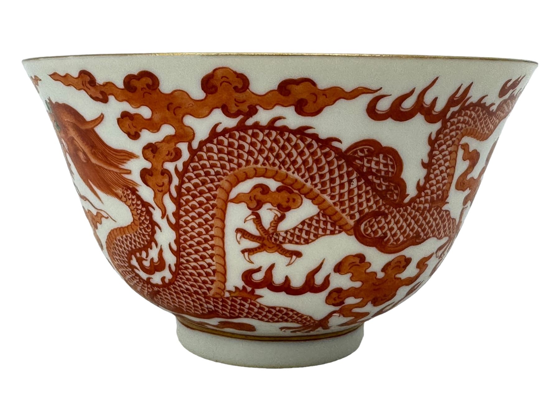 Chinese porcelain iron red tea bowl, the exterior painted with two five claw dragons chasing the flaming pearl, amidst clouds, red Quinlong seal mark beneath, D10.5cm x H6.5cm