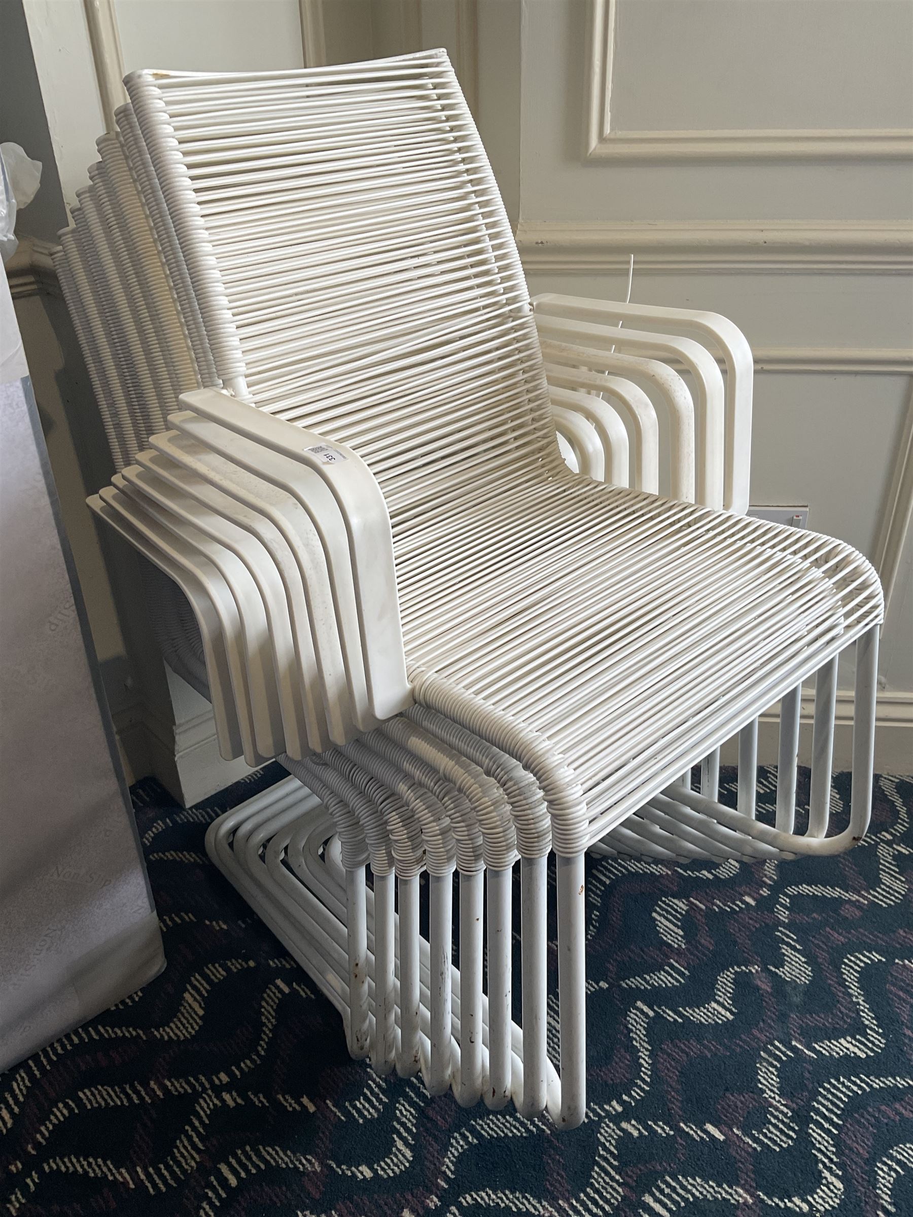 Eight white wicker garden armchairs- LOT SUBJECT TO VAT ON THE HAMMER PRICE - To be collected by appointment from The Ambassador Hotel, 36-38 Esplanade, Scarborough YO11 2AY. ALL GOODS MUST BE REMOVED BY WEDNESDAY 15TH JUNE.