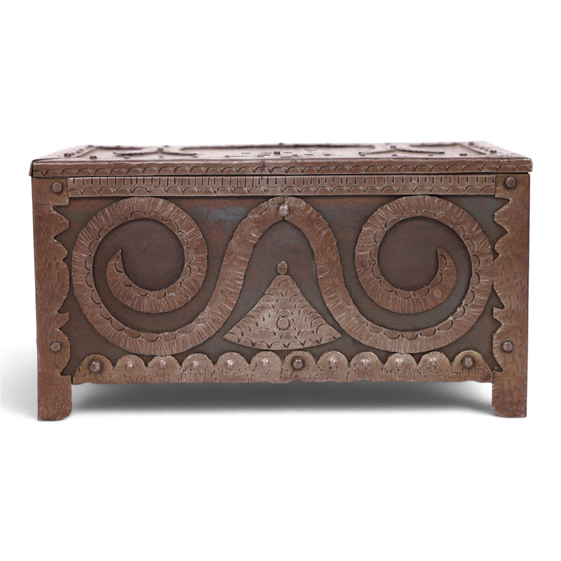 Late 19th/early 20th century vernacular iron box, the hinged cover and sides with applied strapwork decoration, the cover with applied church motif, H11.5cm W22cm D12cm