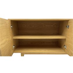 Contemporary light oak sideboard, fitted with double cupboard and three drawers, on tapering supports