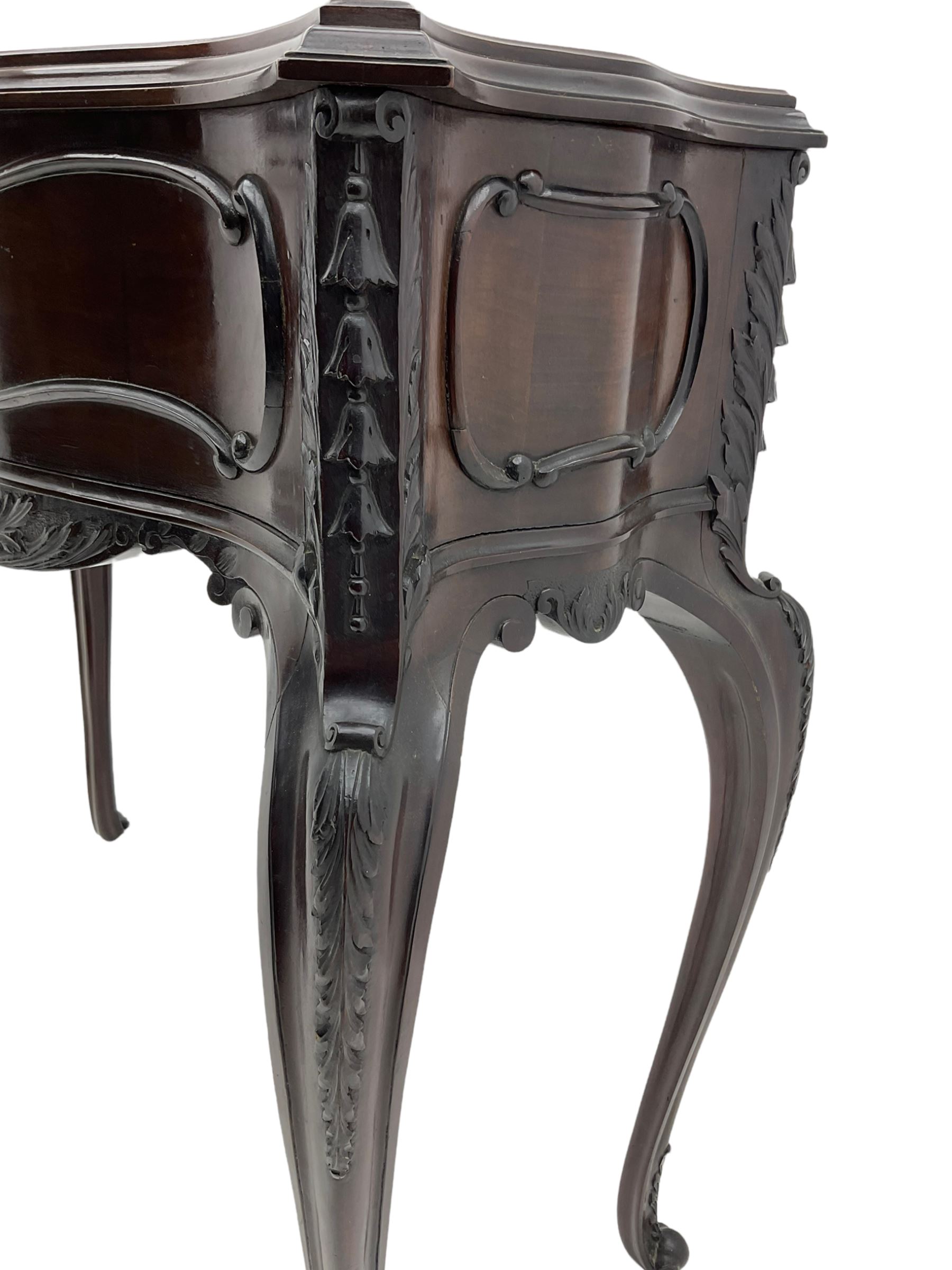 Late Victorian mahogany jardiniere planter stand, shaped form with fixed moulded top, applied c and s scroll mouldings and husks to the frieze and canted corners, acanthus carved cabriole supports with scroll carved terminals, 91cm x 37cm, H85cm