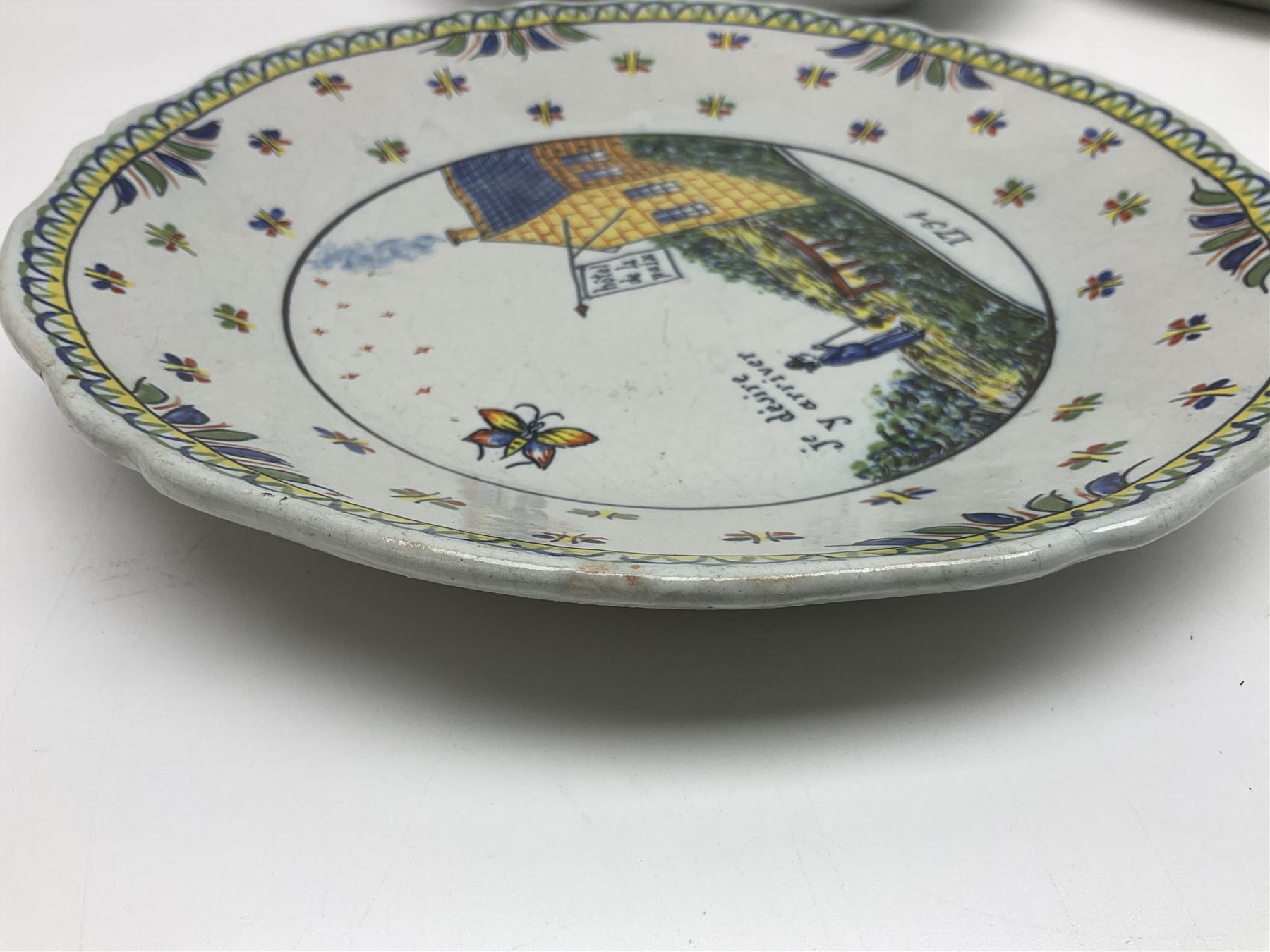Four French Faience plates, comprising Je suis las de le porter, Le malheur nous reunit, Je desire y arriver and Eveque de Meaux, D24cm  