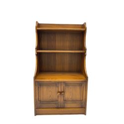 Ercol - medium elm bookcase fitted with two cupboards