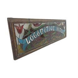 Large 19th century stained glass window, inscribed 'Locomotive Hotel' with surrounding tulip and foliate decoration and lead pane rails
