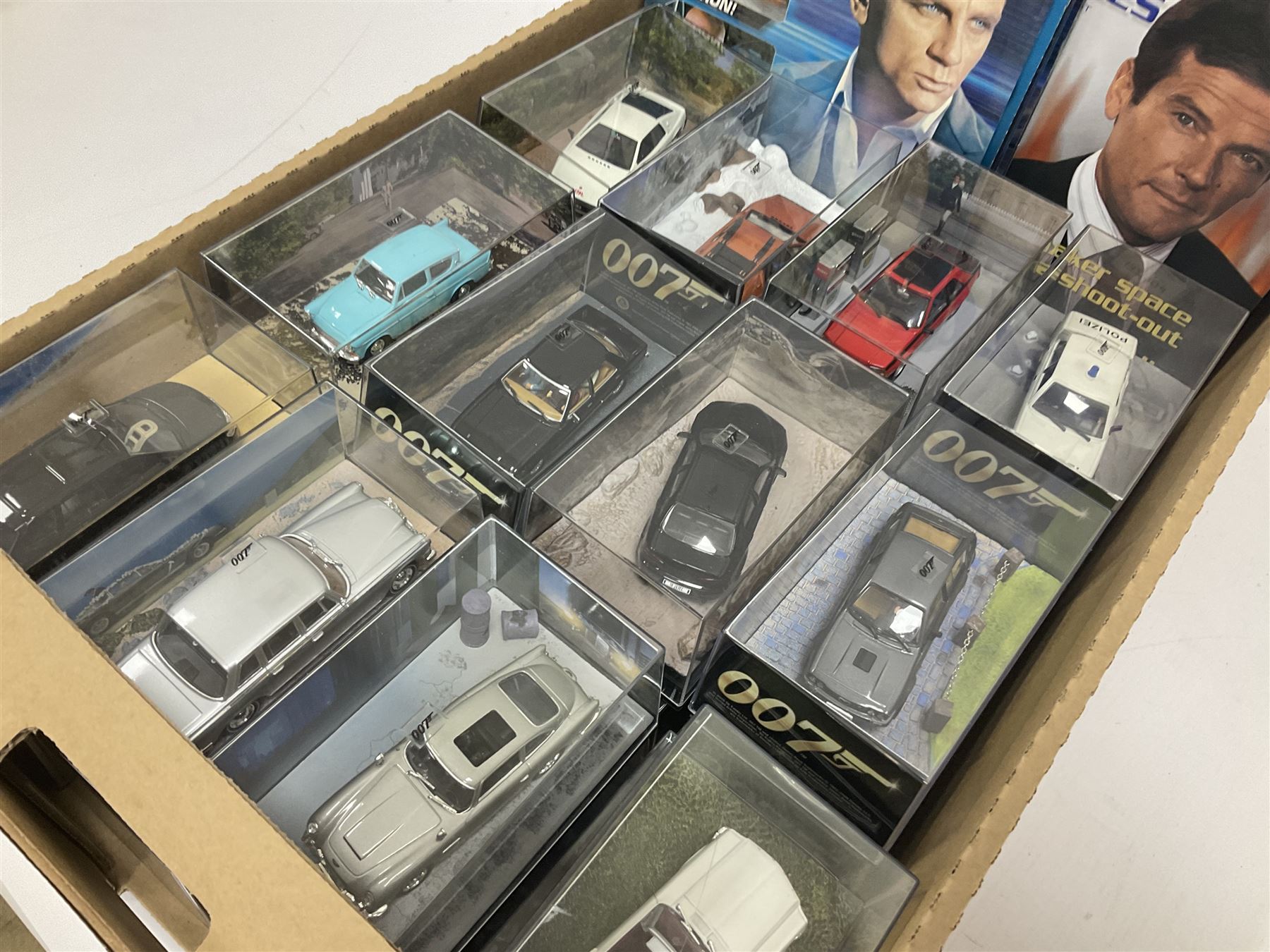 Fabbri James Bond Collection - over one hundred and ten die-cast models in perspex display cases as issued periodically; and a quantity of associated magazines and trading cards, in five boxes