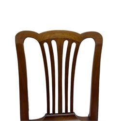 Set of six (5+1) George III mahogany dining chairs, shaped cresting rail over pierced and flared splat, drop-in seat upholstered in crimson and ivory floral patterned fabric, raised on chamfered square supports united by H-stretcher