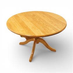 Wharfedale Traditional Furniture - oak dining table and eight ladder back chairs, circular top with stowable leaf forming a large an oval top extending to 167cm, on four splayed legs, together with eight ladder back chairs with green velour drop in seats