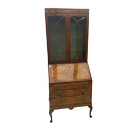 Early 20th century walnut bureau bookcase, two glazed doors over fall front, fitted with three drawers, on shell carved cabriole feet