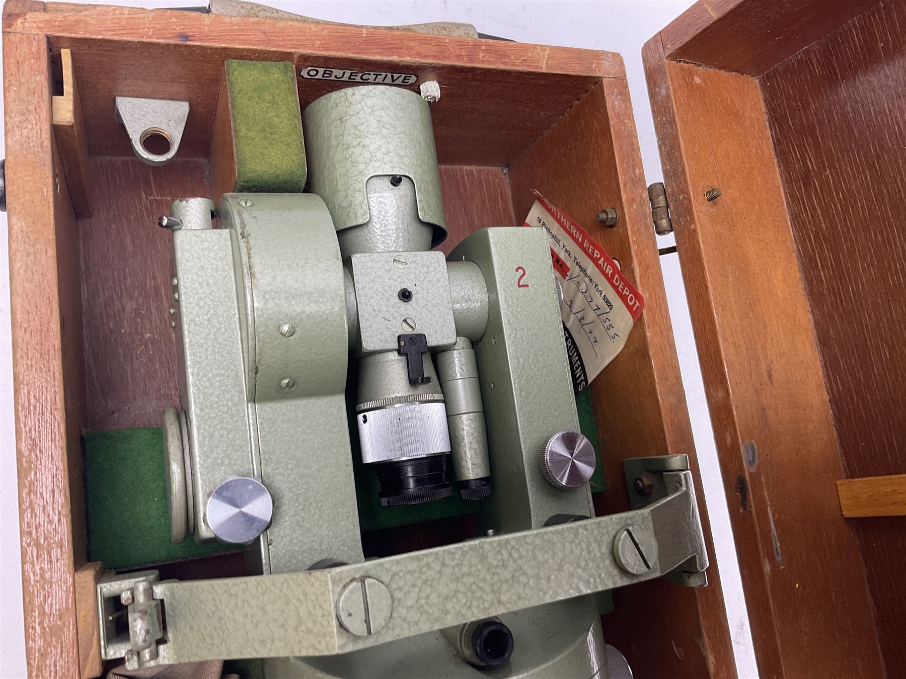 Vickers Instruments England Cooke V22 surveyor's theodolite, No.V.221387, with green enamelled body H32cm; in fitted wooden carrying box with retaining bar and repair label dated 3/8/77.