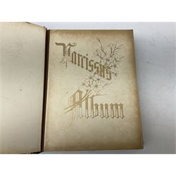 Victorian photograph musical album, the tooled gilt leather bound album opening to reveal various portraits, and a musical movement