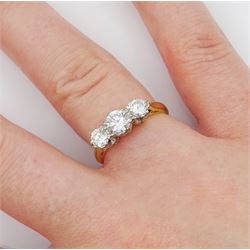 18ct gold three stone round brilliant cut diamond ring, stamped total diamond weight approx 0.95 carat 
