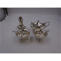 Early 20th century silver mustard pot and cover, of faceted oval form, with shaped rim and acanthus capped scroll handle, upon four pad feet, with matching spoon, H5.5cm, hallmarked I S Greenberg & Co, Birmingham 1912 & 1914, with blue glass liner, together with pair of Victorian silver open salts, of fluted circular form, with lobed rim, upon three pad feet, with matching salt spoons, all hallmarked Atkin Brothers, Sheffield 1899 and a Victorian silver pepper, of waisted baluster form, the part fluted body repousse decorated with flowers and leaves and a floral garland to upper rim, hallmarked William Oliver, Birmingham 1900