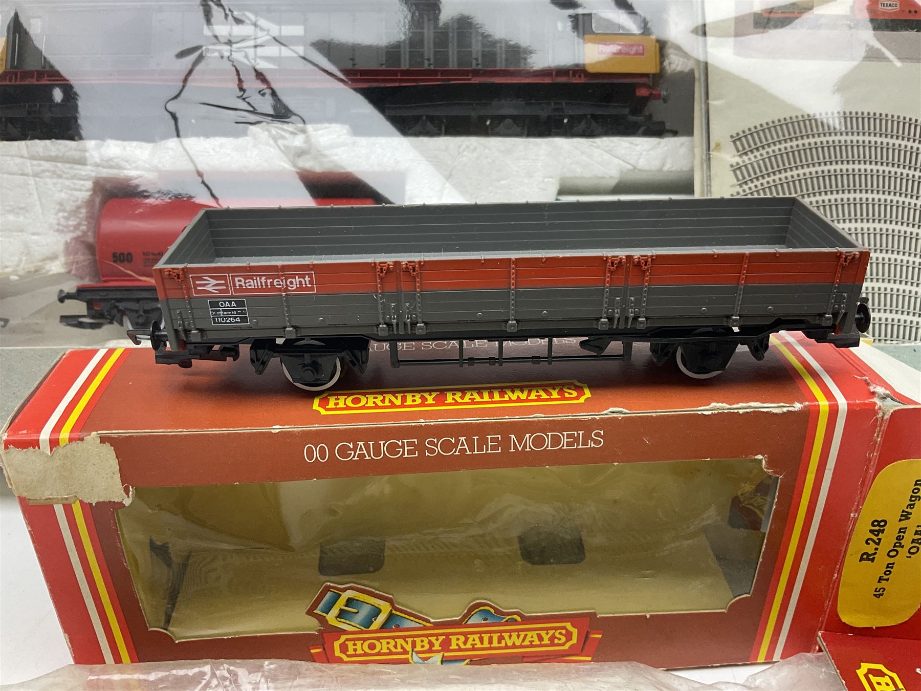 Hornby '00' gauge - Midnight Freight electric train set with Class 58 diesel Co-Co locomotive No.58001, eight wagons, goods shed, track, car loading ramp and power controller etc; boxed with paperwork; together with an additional wagon, figures and platform fencing