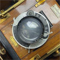 Sanderson Koilos folding plate camera in mahogany and lacquered brass, with 'Ensign Anastigmat Series IV No 2' lens, serial no 173998, with original leather case