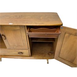 Ercol - mid-20th century light elm 'Windsor (366)' sideboard, fitted with a double cupboard over single drawer, the right-hand cupboard with a cutlery drawer to top over single shelf, on splayed tapering supports
