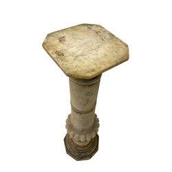 Late 19th to early 20th century marble torchère stand, square top with chamfered corners, the pedestal with ring turns and fluted baluster, on octagonal base