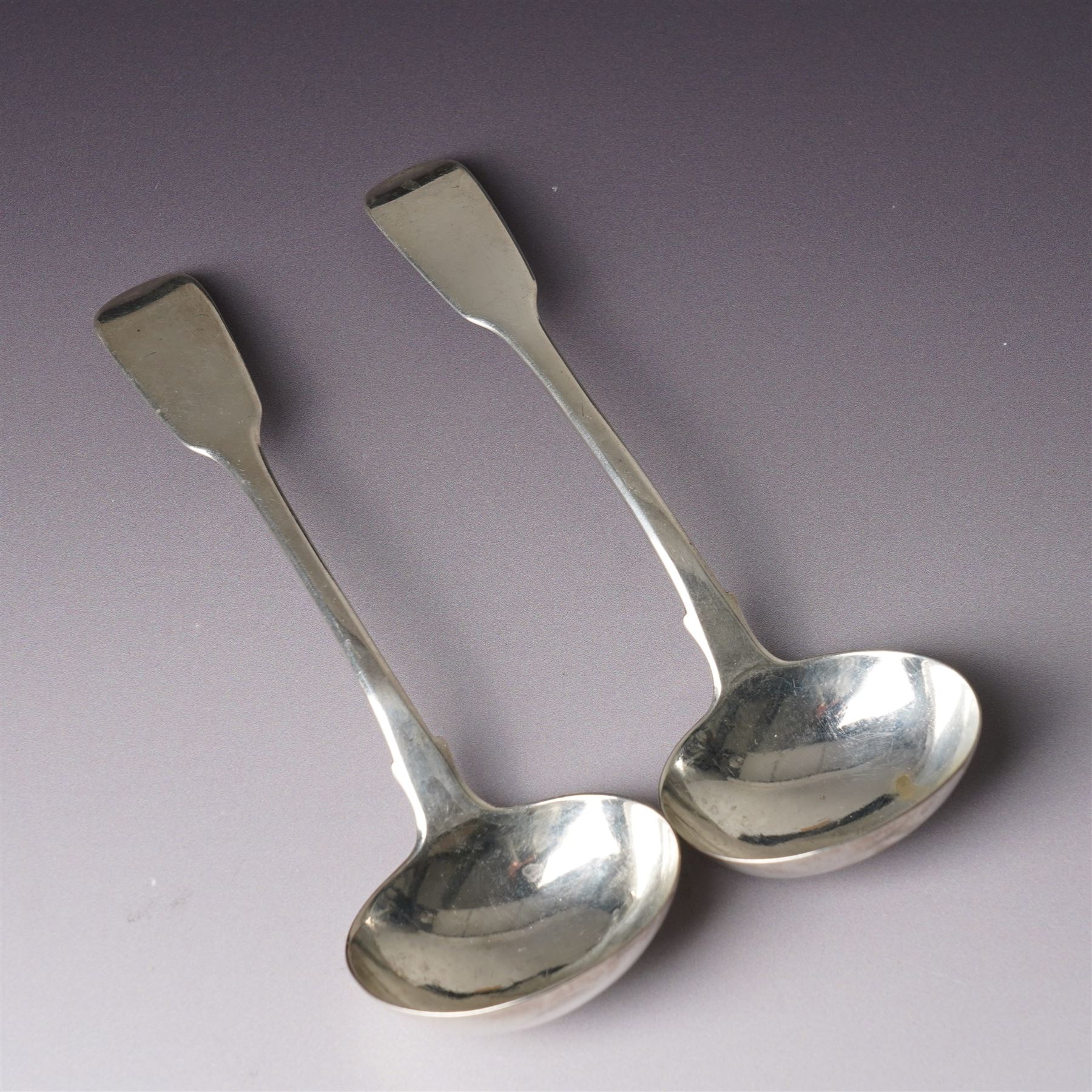 Pair of George IV silver fiddle pattern sauce ladles London 1825 Maker Charles Eley