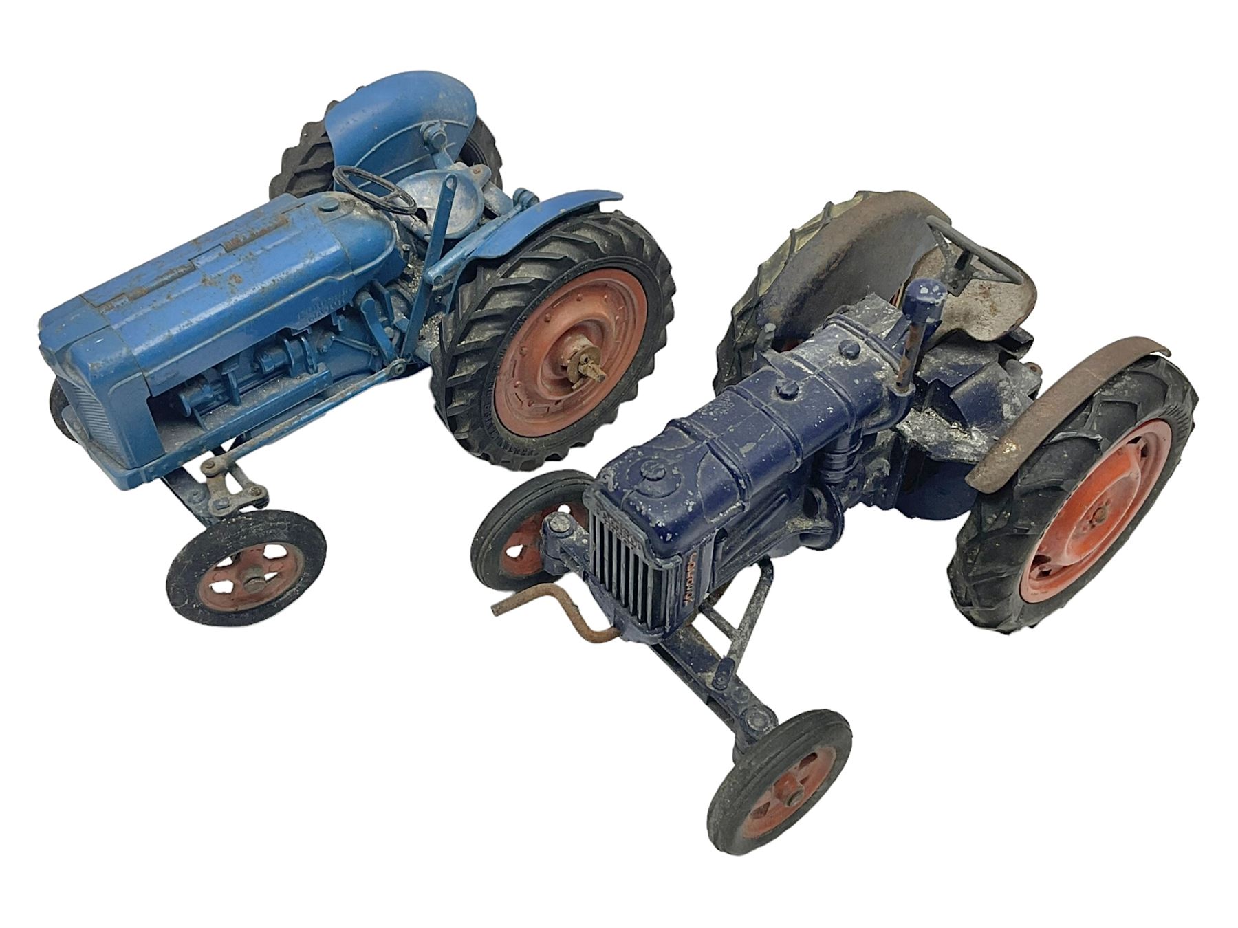 Chad Valley - two unboxed and playworn large scale Fordson tractors - No.9235 Fordson Major Tractor, dark blue diecast body, orange wheels, crank handle clockwork mechanism and 'Firestone' rubber tyres; and No.M59 New Fordson Major Tractor, blue diecast body, tinplate hinged bonnet, orange wheels and clockwork motor contained in rear wheel hub (2)