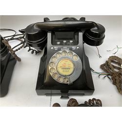 Three vintage Bakelite black telephones, each with chrome dial, together with additional plinths and Bakelite headsets