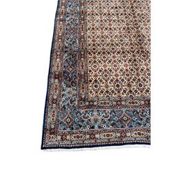 Fine Persian Mood blue ground rug, the ivory field decorated with repeating Herati motifs, the guarded border with stylised geometric foliate patterns 