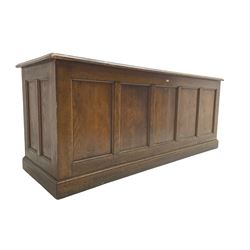 Illingworth Ingham and Co. School Furnishers (Leeds c1900) - early 20th century oak rostrum or headmaster's desk, rectangular top, the front and sides panelled with open reverse, on plinth base