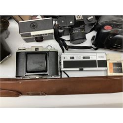 Quantity of Cameras , Lenses and Table Top Viewer- To be assessed 
Collection of cameras, lenses and photography equipment, to include Praktica EE2, Kowa SE, Kodak 66 model II, Inovar, lens Carl Zeiss Jena DDR Flektogon 2.4/35, lens Pentacon Electric f/2.8 135mm, Sunpak auto 2020, tripod  etc, together with a pair of Mark Scheffel 10x50 field binoculars.  