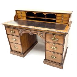Victorian aesthetic oak movement desk, raised back with six drawers above inset leather writing pad, rope twist detailing, six drawers, plinth base