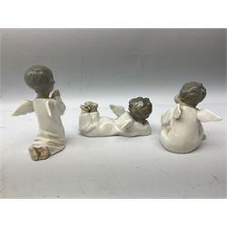 Five Lladro figures, comprising, angel praying, no 4538, angel laying down, no 4541, angel thinking, no 4539, girl with candle, no 4868, and boy kissing no 4869, together with six other similar figures 