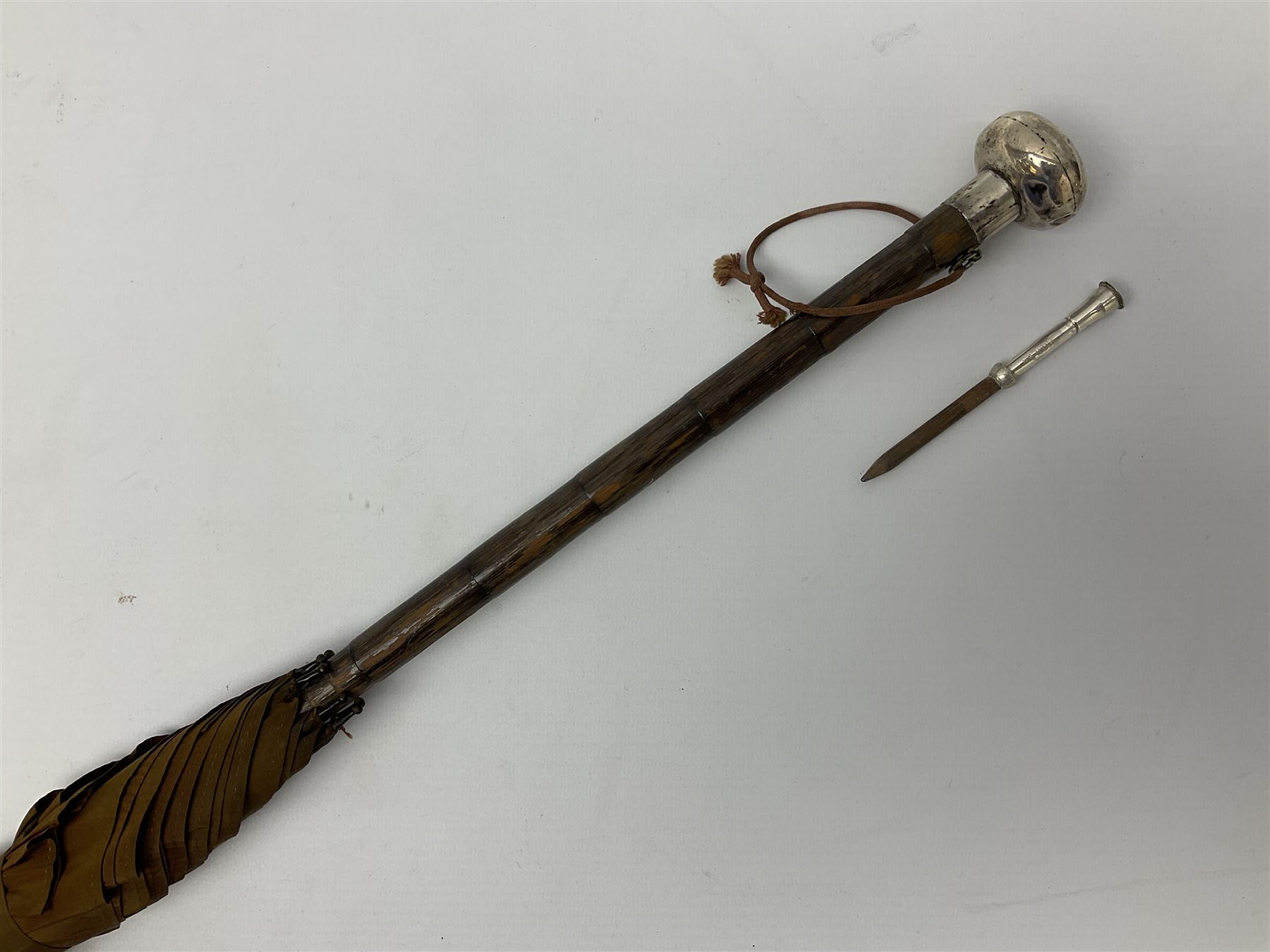 Edwardian novelty parasol by Briggs of London, the bamboo shaft with brown fabric canopy, and silver mounted terminal concealing a silver mounted pencil, hallmarked Charles Henry Dumenil, London 1904, also marked Briggs, H93cm