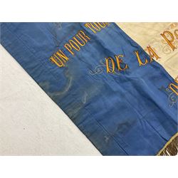 French State Police banner as the tricolor flag embroidered with coloured and metallic thread 'Societe De Secours Mutuels Un Pour Tous Tous Pour Un De La Police D'Eteat De Marseille' to one side; plain flag verso; tassels to three sides 100 x 113cm