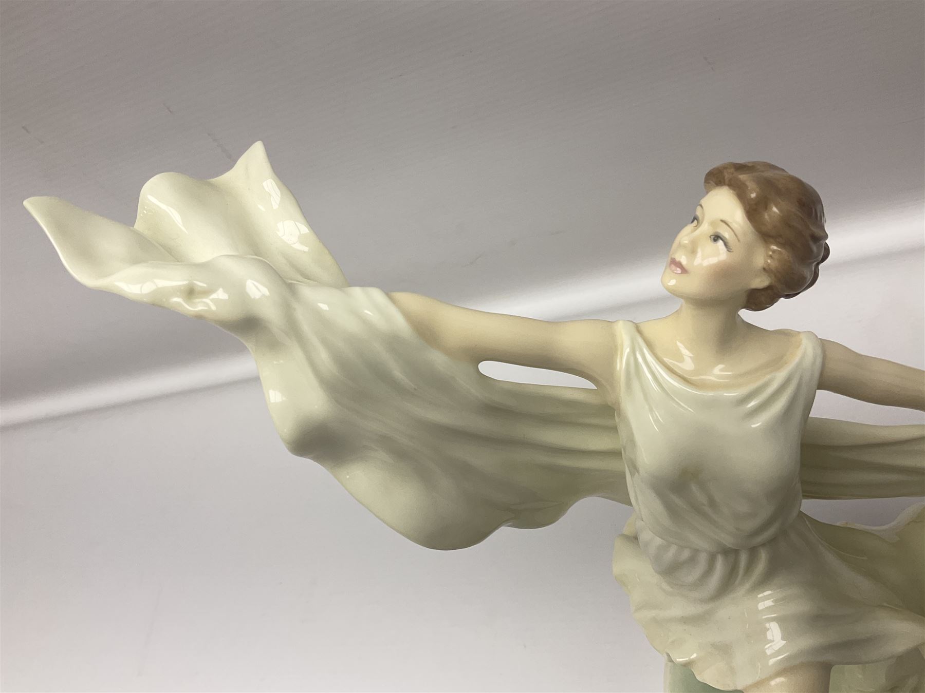 Two Royal Worcester figures, comprising Spirit of the Millennium and Spring, together with Royal Dux figure of two lovers