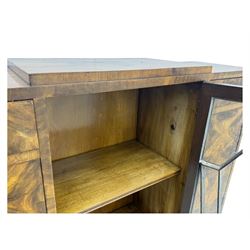 Art Deco burr walnut drinks cabinet, geometric central glazed astragal door enclosing two fixed shelves, flanked by symmetrical bookmatched veneered cupboards with drawers above 