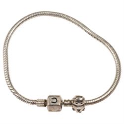 Silver torque bangle and a silver Chamilla charm bracelet 