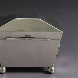 Early 20th century silver tea caddy, of sarcophagus form with twin lion mask mounted loop handles, upon four bun feet, hallmarked William Hutton & Sons Ltd, Birmingham 1913, H8cm, W9cm