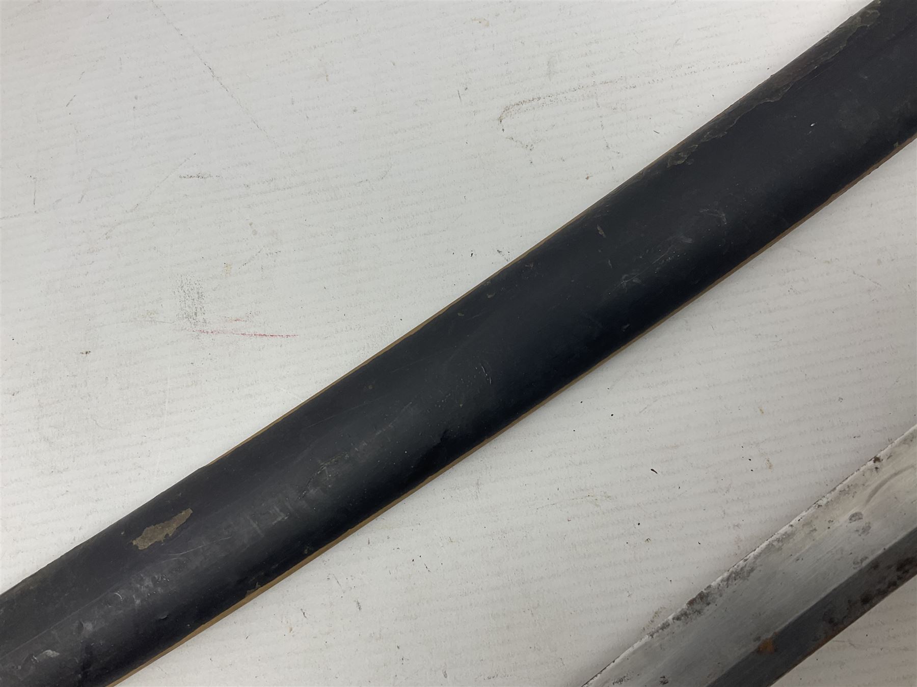 Good quality Japanese sword blade with later WWII fittings and scabbard  - 67.5cm slightly curving blade with unmarked tang, plain iron tsuba and lacquered grip with copper mounts; in lacquered wooden scabbard with tape bound tip L94cm overall