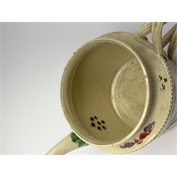 18th century creamware teapot, probably Leeds, with reeded entwined handle and floral finial to the cover, the body with hand painted polychrome decoration of figure to one side, and floral spray to the other, collectors paper label beneath inscribed Leeds Pottery, H11.5cm