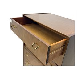 G-Plan teak tallboy, seven drawer chest with brass loop handles, ebonise base with adjustable brass terminals