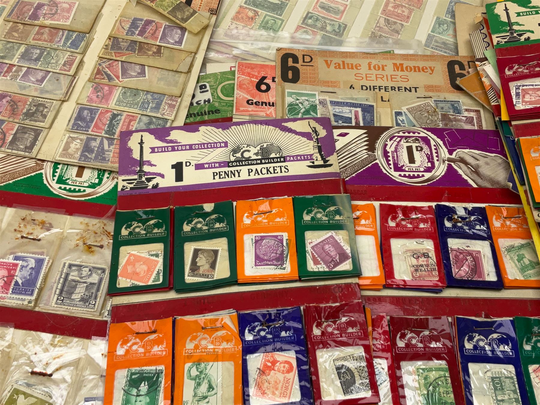 Collection of stamps including packets still mounted to the original shop cards, reading 'A Darracott Product Stamps 1d per pkt' etc, Countries include China, Spain, Argentina, Liberia, Denmark etc, in one box