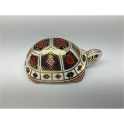 Royal Crown Derby tropical fish paperweight in the form of a Guppy, with a silver stopper, and Royal Crown Derby tortoise paperweight with gold stopper