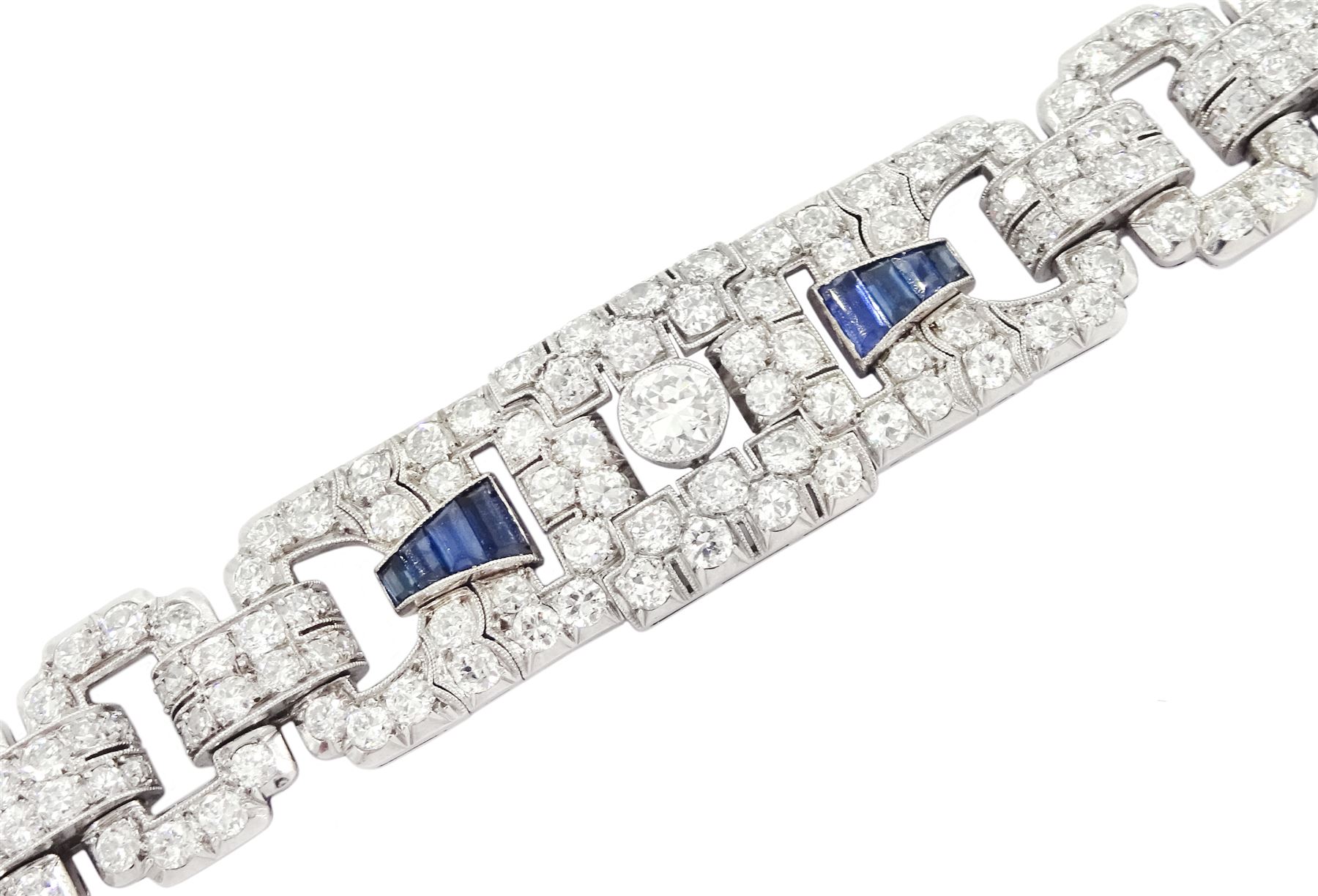 Art Deco platinum milgrain set old cut diamond and calibre cut Burmese sapphire link bracelet, the three principal diamonds each approx 0.50 carat, total diamond weight approx 13.00 - 14.00 carat, stamped Pt, circa 1925, in fitted box by Licht & Morrison, London