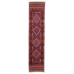 Caucasian design hand-knotted wool runner, indigo blue field decorated with a vertical seq...