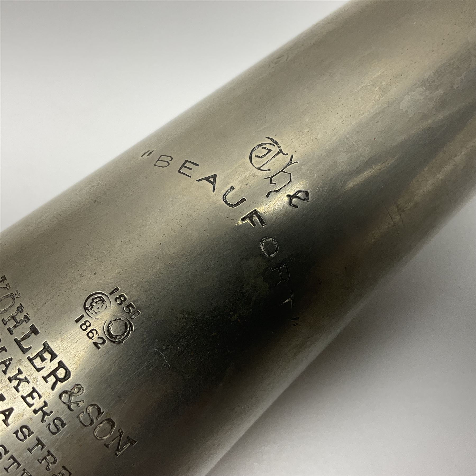 19th century telescopic hunting horn, the bell engraved 'The Beaufort', with makers mark Kohler & Son, makers, 61 Victoria Street, Westminster (from Covent garden) London, in a leather sheath, horn full extended L91cm 