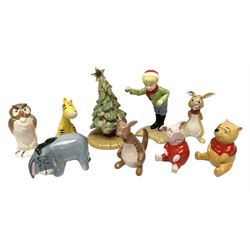 Seven Beswick Winnie the Pooh figures, comprising Pooh Bear, Tigger, Piglet, Kanga, Mr Rabbit, Owl, and Eeyore, together with two Royal Doulton Winnie the pooh Christmas Collection figures, 'The Most Perfect Tree in all the Wood', and 'Christopher Robin Dresses the Tree', (9)  