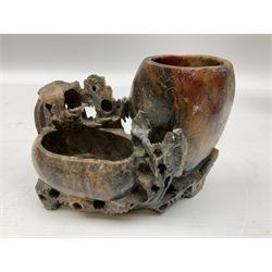 Three soapstone carvings, to include three toed dragon example, carved example with monkeys and another similar, together with carved wood figure, largest L29cm 