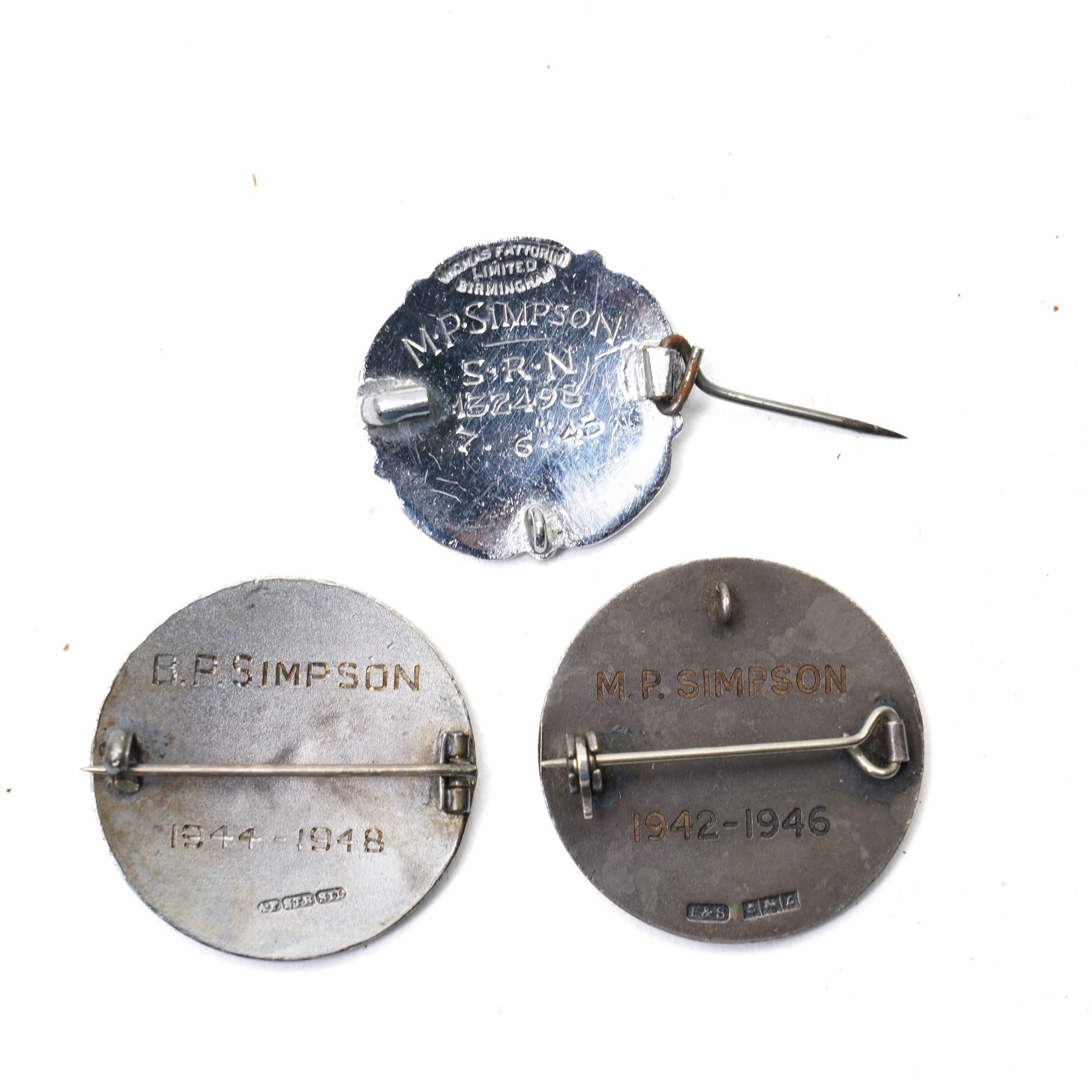 Group of early 20th century sporting medallions, fobs and badges, including two silver Inter Varsity 1/4 mile cased medallions, two silver fobs, white metal and enamel cricket fob etc, one awarded to John Barugh Fisher (1888-1924) born in Amotherby, studied at Leeds University and became doctor in 1911, later Captain John Barugh Fisher R.A.M.C., together with four early 20th century nurses badges, two for General Infirmary Leeds, three inscribed B.P. Simpson, housed in an inlaid work box