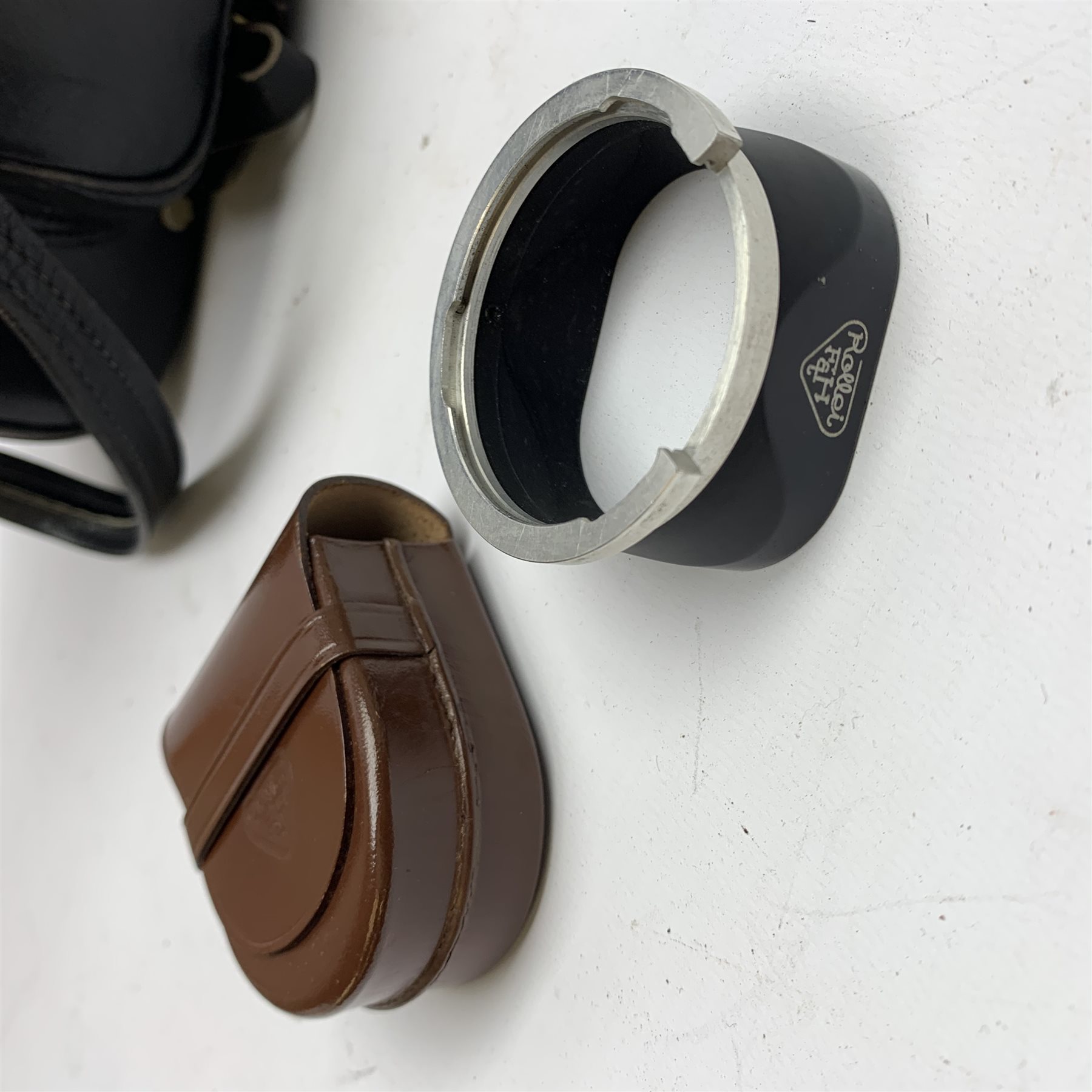 Rolleiflex 2.8F camera in leather case together with; 'In Practical Use' instruction manual, Rolleipol -1.5 lens in case, Rollei Rolleiflex lens hood Bay III in case, Rollei Gelb Mittel -1.5 filter in case, Rollei R1 -0 lens in case, Heidosmat-Rolleinar 1 with Rolleinar 1, Weston Master IV light meter and Weston Master IV Invercone in cases, Rollei Rolleiflex Rolleikin in case, hand grip with Rolleifix plat, all in carry case