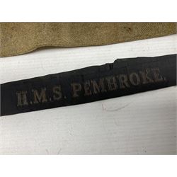 WW1 British Army Derby Scheme 1915 Attested armband; beret with East Yorkshire cap badge; pair of fur lined leather flying/motorcycle goggles; HMS Pembroke cap band; and small quantity of RNAS cloth and metal badges etc