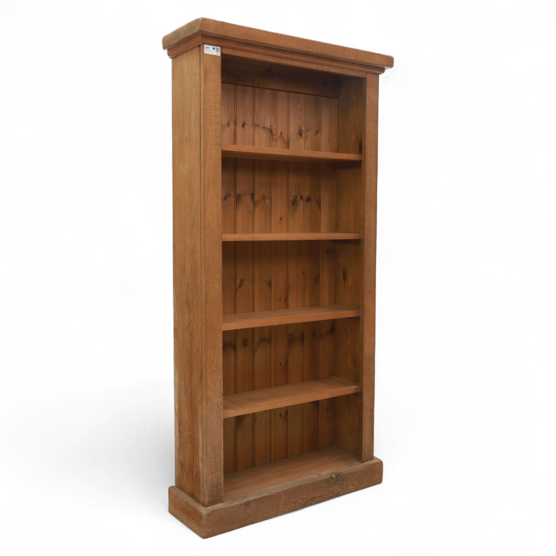 Contemporary oak open bookcase, with moulded cornice above five fixed shelves and boarded back, on plinth base