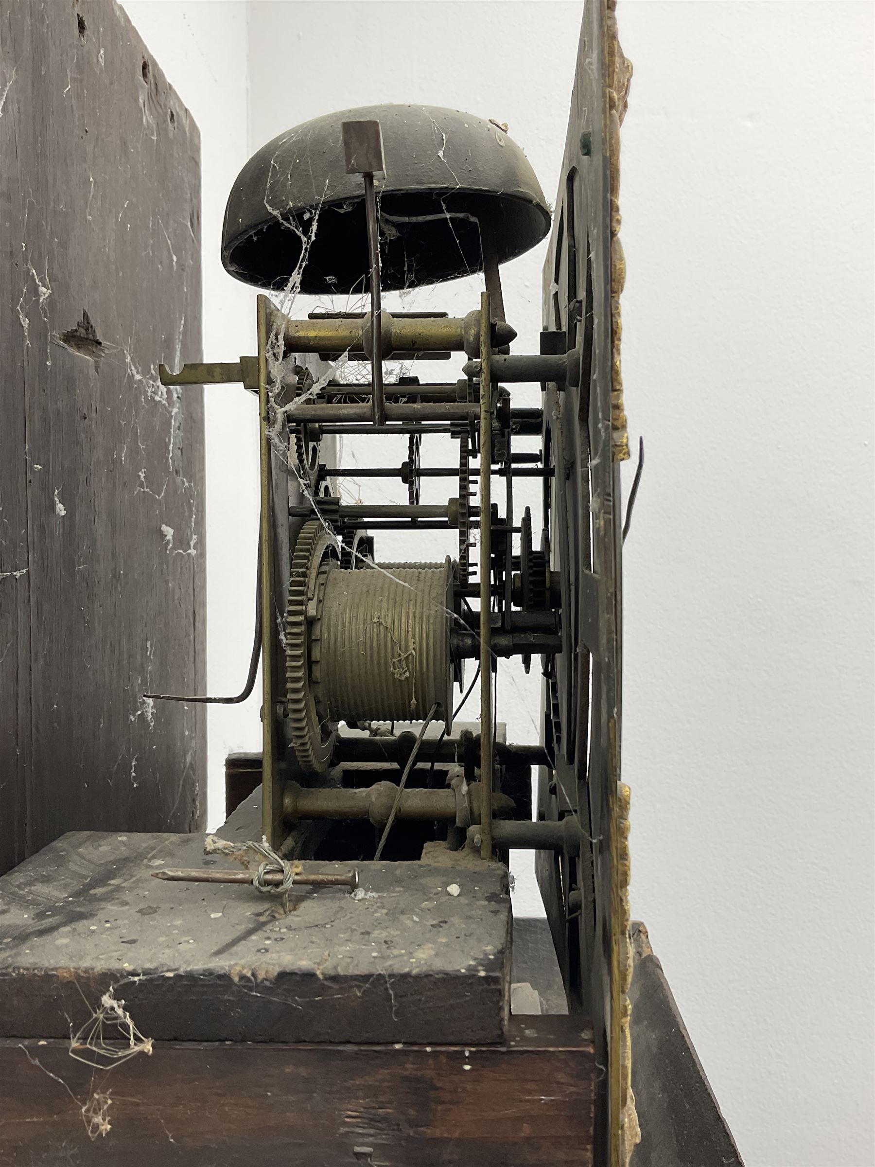 18th century oak longcase clock with later carving, the hood with projecting cornice over square glazed door, trunk door carved with tree of life, foliage carved base, on ogee bracket feet, brass dial with Roman chapter ring and subsidiary seconds and calendar aperture, ornate mask cast spandrels, twin train driven movement striking on bell 
